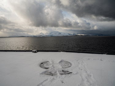 A snow angel on the flight deck of the Italian aircraft carrier Giuseppe Garibaldi during 'Cold Response 2022' (CR 22), a Norwegian military exercise involving invited allies and partner nations held...