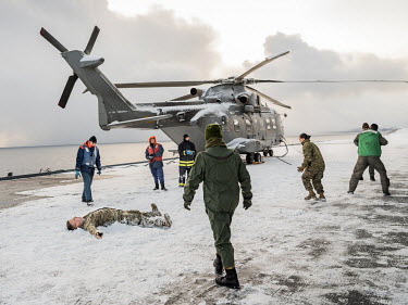 Soldiers take part in a snow ball fight on the flight deck of the Italian aircraft carrier Giuseppe Garibaldi during 'Cold Response 2022' (CR 22), a Norwegian military exercise involving invited allie...