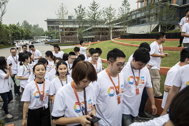 A group of employees outside at the Alibaba Group Holding Ltd. headquarters.