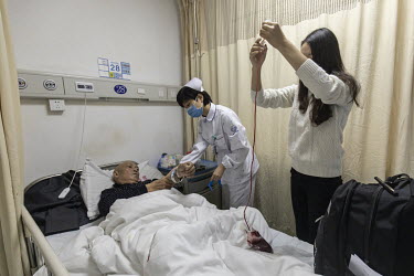 An Anhui Kedgene Biotechnology employee takes blood from a cancer patient taking part in a genetic treatment trial at a hospital in Hangzhou. Unhampered by rules, China is racing ahead of the west in...