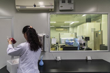 An Anhui Kedgene Biotechnology employee handles blood from cancer patients taking part in genetic treatment trials at the company's lab in Hefei. The samples will be used to develop therapies for the...