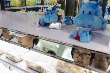 Employees purchase groceries and snacks at a Hema or Fresh Hippo store at the Alibaba Group Holding Ltd. headquarters.