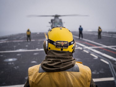 Flight deck crew on board Italian aircraft carrier Giuseppe Garibaldi during 'Cold Response 2022' (CR 22), a Norwegian military exercise involving invited allies and partner nations held between 14 Ma...