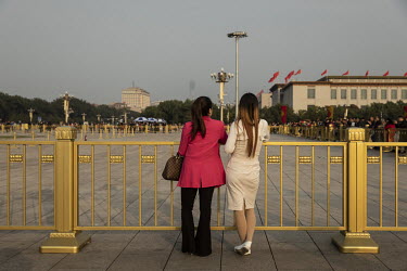 Visitors stand on Tiananmen Square during the Chinese Communist Party's congress in the Great Hall of the People.