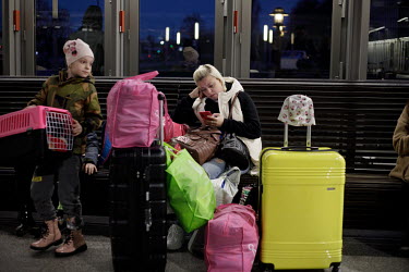 Ukrainian women and children, displaced by the war, at the Wschodnia (East) train station in Warsaw, from where they are heading back into Ukraine. Since the withdrawal of Russian forces from some par...