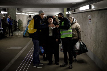A volunteer helps Ukrainians who have come to the Wschodnia (East) station in order to get a train back into Ukraine after being displaced by the war. Since the withdrawal of Russian forces from some...
