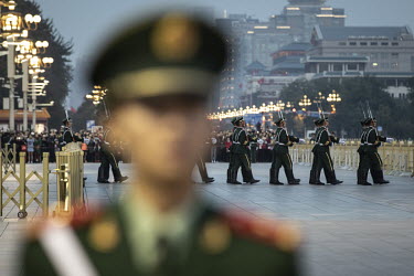 Military honour guards stand on Tiananmen Square during the morning flag raising ceremony during the Chinese Communist Party's congress in the Great Hall of the People.