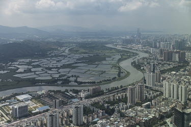 A view of the city of Shenzhen and the farms and wilderness of Hong Kong's New Territories.