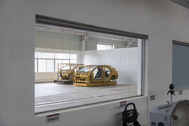 A vehicle chassis sits on a Seattle Safety LLC testing sled in a lab at the BYD (Build Your Dreams) headquarters.
