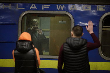 Ukrainians say 'goodbye' through the window of a Kiev (Kyiv) bound train at the Wschodnia (East) station. Since the withdrawal of Russian forces from some parts of the country, many people, displaced...