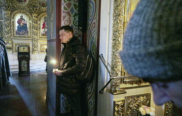 People attend Mass on Orthodox Good Friday in Saint Sophia Cathedral.