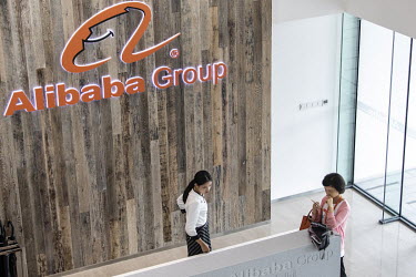 An employee stands behind the reception desk at the Alibaba Group Holding Ltd. headquarters.