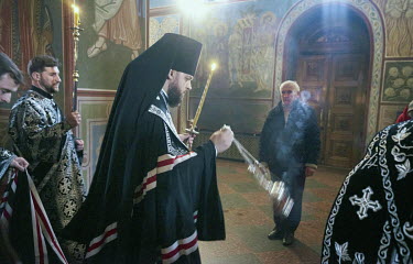 The head of the new Orthodox Church in Ukraine, Metropolitan Epiphanius, burning incense during Orthodox Good Friday in Saint Sophia Cathedral.