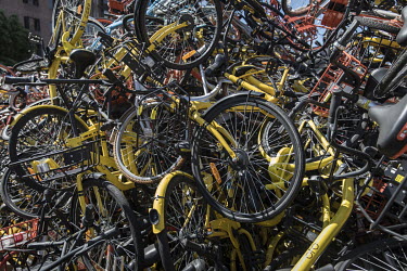 A mountain of discarded shared bicycles piled up in a parking lot. While cheap, convenient, and theoretically environmentally friendly, the craze and commercialisation of shared bikes initially create...