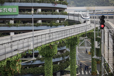 A prototype monorail train operates through the campus of at BYD (Build Your Dreams) headquarters.