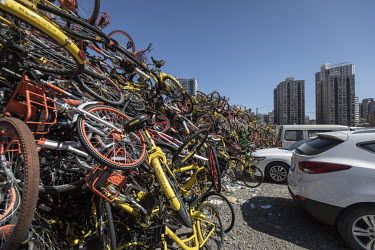 A mountain of discarded shared bicycles piled up in a car park. While cheap, convenient, and theoretically environmentally friendly, the craze and commercialisation of shared bikes initially created m...