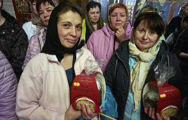 Doctors and nurses from the National Clinical Center of the Ministry of Defense of Ukraine hold Easter bread (Paskha) at the Church of the Blessed Virgin.