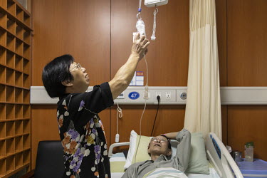 An intravenous drip is set up for a cancer patient taking part in a genetic treatment trial at a hospital in Hangzhou. Unhampered by rules, China is racing ahead of the west in gene-editing treatments...