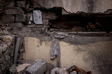 A shirt lies amid the rubble of the house where Rafi al-Iraqi and his family were living when it was hit by an US airstrike aimed at a nearby ISIS base.