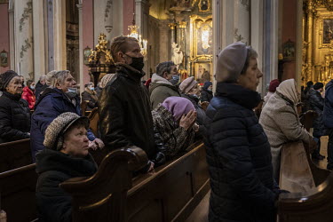 People pray during morning mass on Ash Wednesday at the Assumption of the Blessed Virgin Mary Catholic Cathedral.