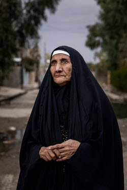 Ruzqaya, the mother of Ali, who was killed by a US airstrike. Early one morning, Ali, a scrap vendor, set out from his home in West Mosul with his trusty red cart, which he usually filled with cans, b...