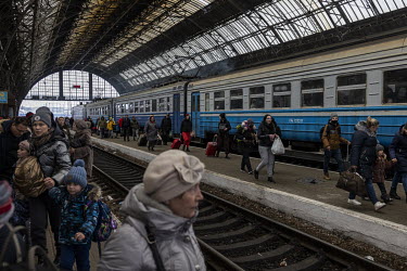 People arrive into and waited to depart the central train station as thousands of Ukrainians continued to flee the war in their country, while some returned home to join the fight.