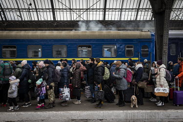 People arrive into and waited to depart the central train station as thousands of Ukrainians continued to flee the war in their country, while some returned home to join the fight.
