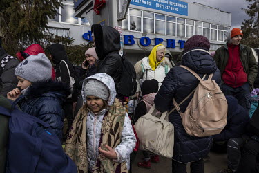A crowd of several thousand or more, mainly women and children, queue up in the freezing cold at the Shehyni border crossing between Ukraine and Poland, waiting to cross into Europe on foot. Busses to...