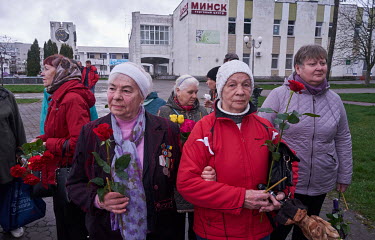 Women, carrying red roses, visit the Chernobyl Memorial which is dedicated to the firefighters and workers who went, ill-equipped, into the reactor to try and extinguish fires and prevent further prob...