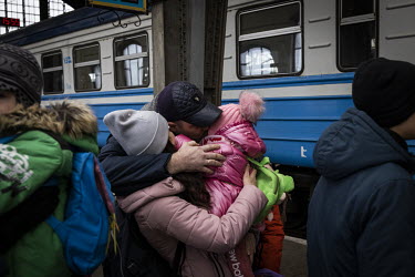 Dima Kurganov (39) says goodbye to his wife and two children before they boarded an evacuation train to Poland.