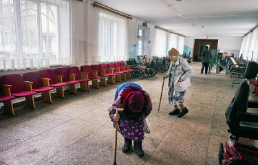 Elderly people in the hall at the Chernihiv Geriatric nursing home where 320 pensioners live. 225 of the residents are unable to walk and its director, Victor Vladimirovich Kulaga, has described how d...