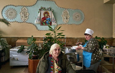 Elderly people eat lunch in the dinning room at the Chernihiv Geriatric nursing home where 320 pensioners live. 225 of the residents are unable to walk and its director, Victor Vladimirovich Kulaga, h...