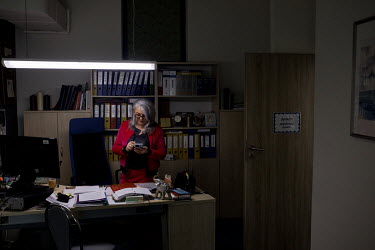 Marzena Dabrowska, director of the primary school number 81 in her office. Around 10% of the school's pupils are from Ukraine, most of them have been forced to flee the war.