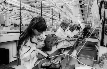 Workers assembling electronic boards at the GEC Marconi factory.