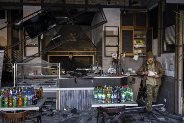 A cafe badly damaged by Russian bombing, some said from a falling piece of a missile, in Kurenivka, western Kyiv.