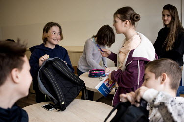 Ukrainian children L-R: Ilya (13), Vanilia (13) and Sofia (13) during a lesson at public primary school number 81 where around 10% of the school's pupils are from Ukraine, most of them have been force...