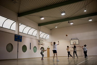 Ukrainian and Polish pupils play basketball during a physical education lesson at public primary school number 81 where around 10% of the school's pupils are from Ukraine, most of them have been force...