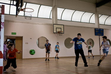 Ukrainian and Polish pupils play football, with Ilya (13), from Kiev in goal, during a physical education lesson at public primary school number 81 where around 10% of the school's pupils are from Ukr...