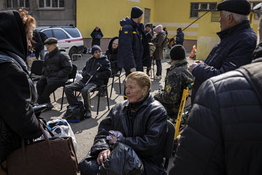 As heavy fighting continued in the nearby town of Irpin, a steady stream of tired, mainly elderly, civilians were evacuated to safety. They gathered at an aid station on the outskirts of Kyiv where th...