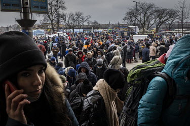 Massive queues of thousands of women and children wait to buy tickets and board evacuation trains at Liviv station, many of them bound for Europe.