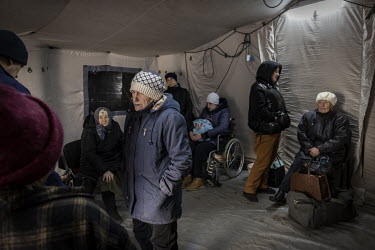 As heavy fighting continued in the nearby town of Irpin, a steady stream of tired, mainly elderly, civilians were evacuated to safety. They gathered at an aid station on the outskirts of Kyiv where th...