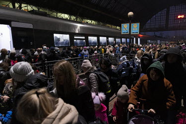 Large queues formed as people arrive into and wait to depart from the central train station.