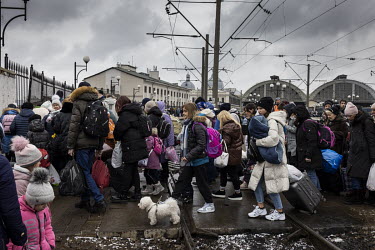 A train full of passengers cross the tracks at Lviv train station after they arrived from Kiev (Kyiv).