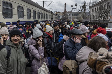 A train full of passengers crowd onto a platform at Lviv train station after they arrived from Kiev (Kyiv).