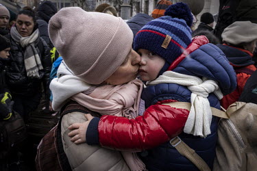 Olena Tuliakova kisses her son Ilya after arriving into Lviv train station having escaped from the besieged city of Kharkiv in eastern Ukraine.