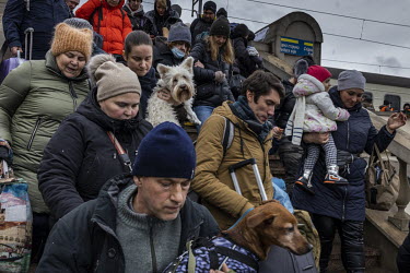 A train full of passengers crowd into Lviv train station after they arrived from Kiev (Kyiv).