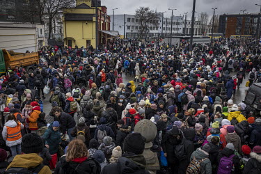 A crowd forms at Lviv train station after a train brought thousands of people fleeing from Kiev (Kyiv).