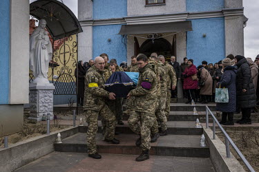 Fellow soldiers carry the coffin of Senior Sergent Yevhen Verveyko of the Ukranian National Army, who was killed fighting against Russian forces.