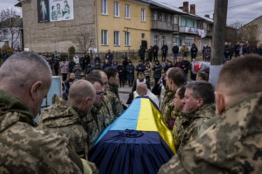 Fellow soldiers carry the coffin of Senior Sergent Yevhen Verveyko of the Ukranian National Army, who was killed fighting against Russian forces.