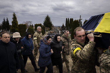 Anzhelika Verveyko (24) is comforted by a friend during the funeral ceremony for her husband, Senior Sergent Yevhen Verveyko of the Ukranian National Army, who was killed fighting against Russian forc...